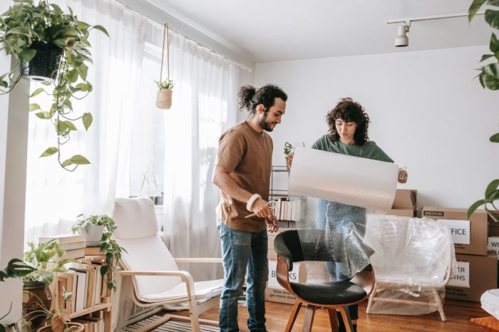 a young couple packing up for their move out