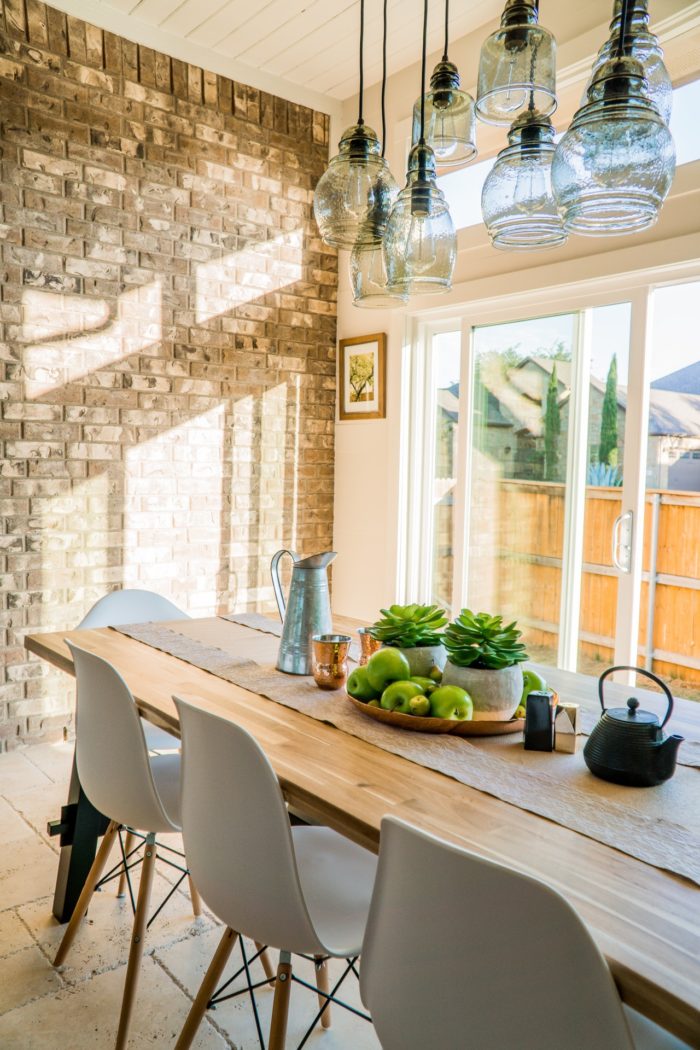 a clean and clutter free wooden dining room table