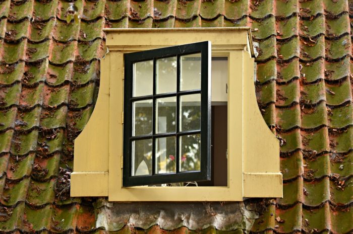 open exterior window on the top floor of a house