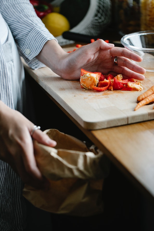 food scraps being put in a bag