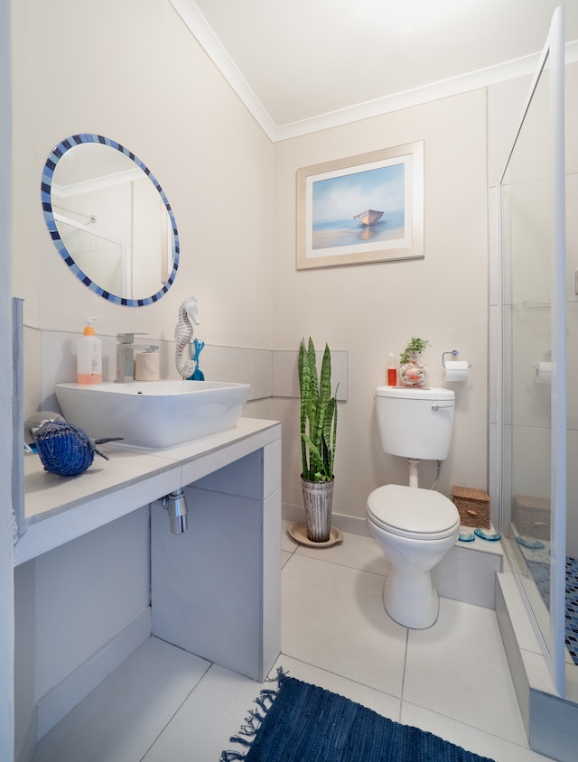 a very clean bathroom sink and toilet