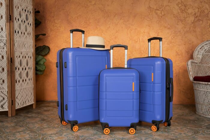 3 blue suitcases